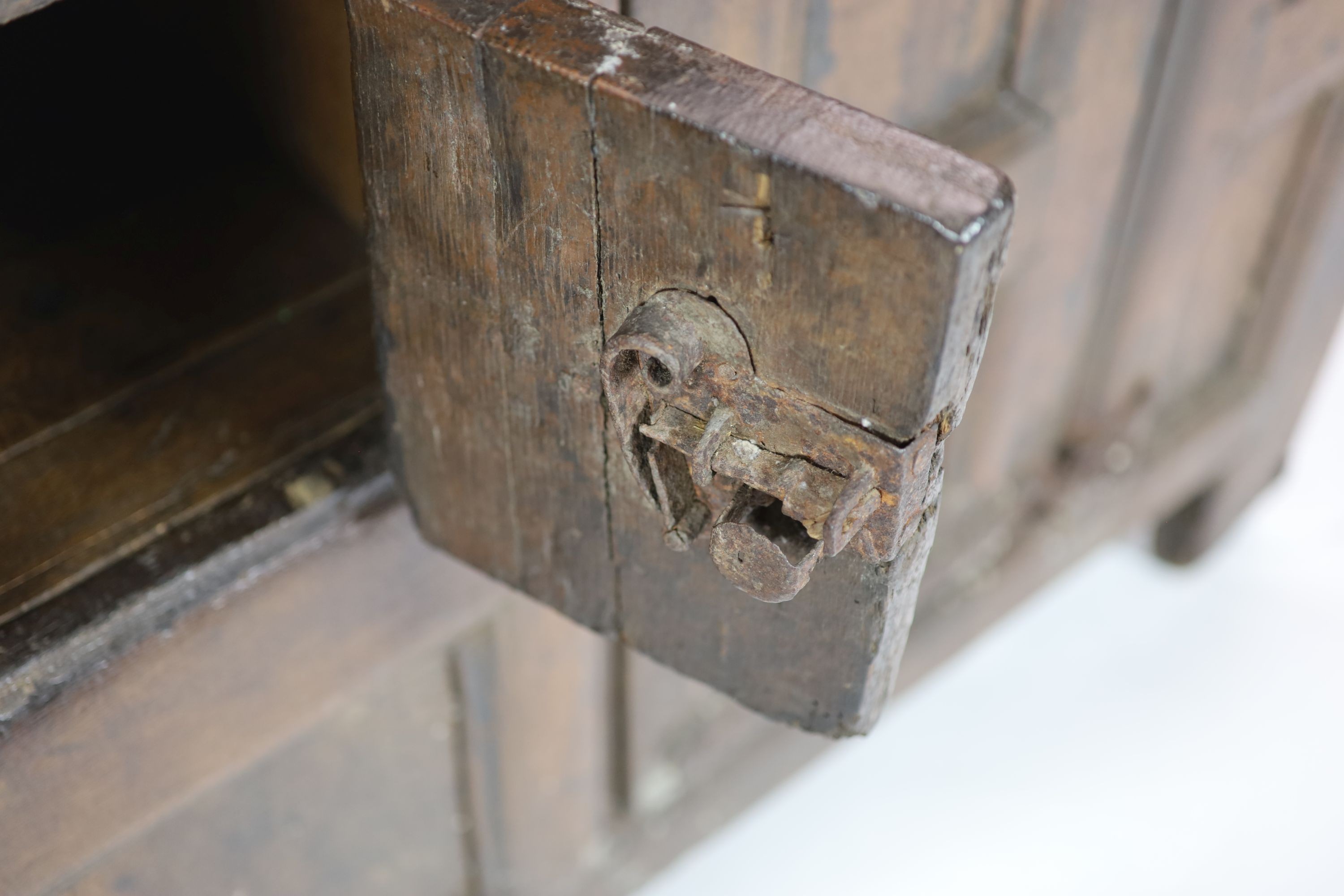 A late 16th/early 17th century German oak side cupboard H 104cm. W 185cm. D 49cm.